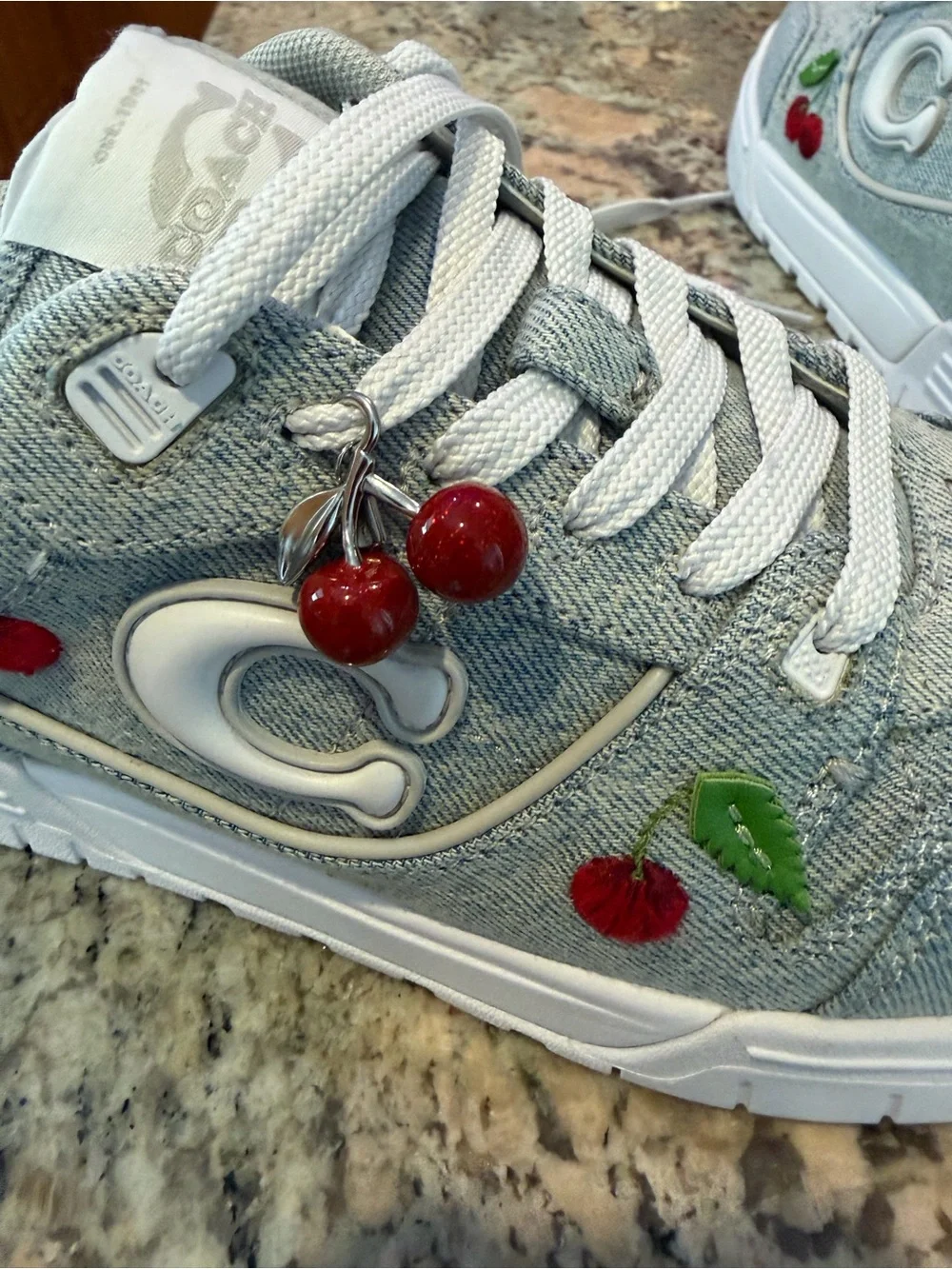 Coach Women’s Light Blue Denim Sneakers with Red Cherry Embroidery